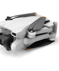 Mini 3 Drone With RC Remote Bundle Portable 4K Quadcopter folded in gray showing front view.