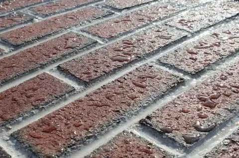 Close-up of brick surface treated with Top Shelf Concrete Water Repellent Sealer 5 Gallon Water Based Silane Siloxane.