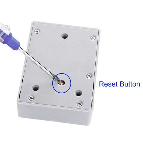 Detail of reset button on Rfid Electronic Cabinet Lock For Wooden Drawers And Cupboards Gray with screwdriver installation.