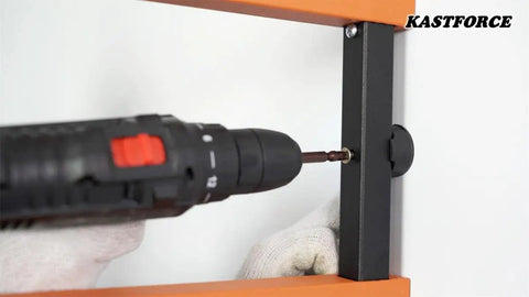Installing Orange Lumber Storage Rack, 3-Level System, using durable sheet metal screws and heavy-duty tools in workshop