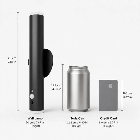 Battery Powered Wall Sconce Dual Pack With Motion Sensor in black beside soda can and credit card, showing size comparison.
