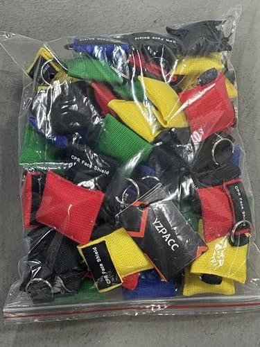Yzpacc 50-pack colorful disposable CPR masks with key rings and one-way valves in a clear bag