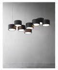 Sleek Modern Led Pendant Light For Kitchen And Dining Room With Dope Iron Frame And Killer Warm Glow Smooth Acrylic Shades Dimmable Switch For Chill Home Vibes, black iron frames with smooth acrylic shades overhead.