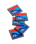 Various Compact Flash memory cards stacked, showing 128MB, 256MB, 512MB, 1.0GB, and 2.0GB sizes for digital cameras and gear.