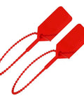 One Thousand Bulk Red Tamper Proof Security Seals For Fire Extinguishers First Aid Kits And Medical Cabinets UL Inspected Heavy Duty Wire Locks, close up view of red zip tie locks.