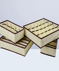 Fine Digs Non Woven Drawer Dividers For Bras And Underwear Plus Four Pack Closet Storage Bins stacked in beige, designed for organized lingerie.