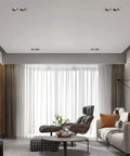 Top Shelf Double Head LED Recessed Downlight 5 Pack Adjustable Gimbal Wafer Lights 3000K Through 6000K Rugged Aluminum Build installed in modern living room ceiling.