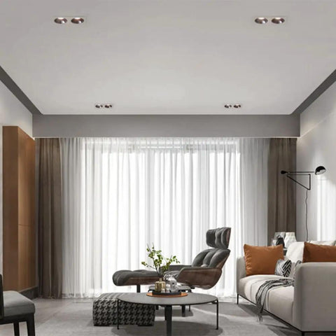 Top Shelf Double Head LED Recessed Downlight 5 Pack Adjustable Gimbal Wafer Lights 3000K Through 6000K Rugged Aluminum Build installed in modern living room ceiling.