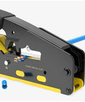 Close-up of All In One RJ45 Pass Through Crimp Tool for Cat5e Cat6 Cat6a data cables with built-in wire stripper and cutter, yellow.