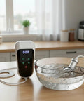 Portable Ultrasonic Cleaning Wand Featuring 60khz Sonic Cavitation Technology in a bowl of water on a kitchen countertop.