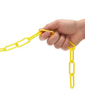 Hand holding 100 Foot Yellow Plastic Safety Barrier Chain for Construction Sites and Garages Non Marring No Rust High Visibility Barricade Link