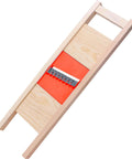Wave Waffle Crinkle Cutter with stainless steel blade and orange base in wooden frame