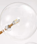 Close-up view of the clear glass bulb in Stunning Six Head Kitchen Pendant Lights Matte Glass Table Chandelier for Dining Room Lighting.