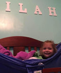 Kid Friendly Camping Hammock For Indoors And Outdoors with child in blue hammock, easy setup in bedroom, great starter hammock for kids.