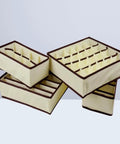 Super Slick Non Woven Drawer Dividers Keep Bras And Underwear Super Tidy In This 4 Piece Lingerie Closet Storage Set displaying beige panels.