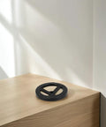 Indoor Fire Hydrant Hand Lever Valve Replacement Wheel on table, black iron handle, sturdy and durable design.