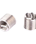 Close-up of stainless steel threaded inserts from Thread Repair Kit M4x0.7 Stainless Steel Twisted Drill Wrench Threaded Inserts Set For Metric Imperial Hole Conversion And Quick Thread Repair Pro Grade Durable Auto Machinery And Metal Projects.