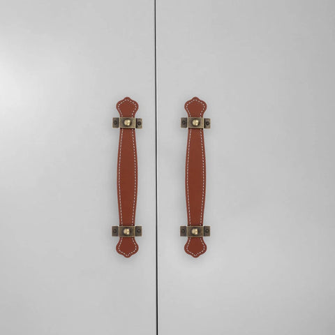 Vintage Leather Trunk Handle Replacement For Cabinets And Drawers Brown Leather Cabinet Pulls shown on white cabinet doors