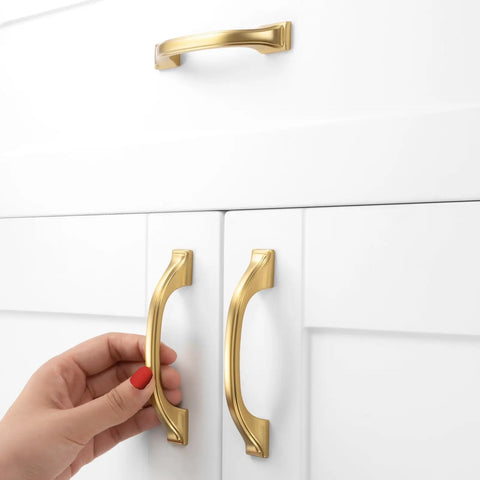 Brushed Gold Cabinet Hardware Three Inch Center To Center Drawer Pulls Ten Pack Heavy Duty Solid Metal kitchen handles on white cabinets.
