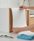 Applying Self Adhesive Wallpaper Roll Subtle Gray Linen Texture Waterproof Vinyl Peel and Stick Film on kitchen cabinet.