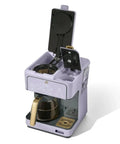 Total Game Changer Multi Brew Coffee Maker 12 Cup Glass Carafe with open lid showcasing brew mechanism and lavender finish.