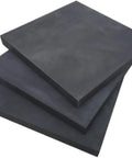 Stack of high purity 99.99 percent graphite block plates for metal casting, 200 by 35 by 5 millimeters, demonstrating high temperature resistance.