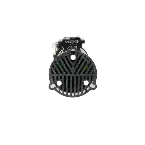 Front view of a circular mechanical component with a grill design and brand marking, isolated on a white background.