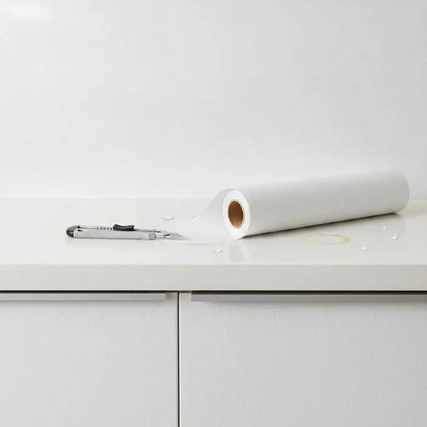 Self Adhesive Wallpaper Roll Subtle Gray Linen Texture Waterproof Vinyl Peel and Stick Film on countertop with cutter