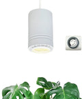 Solid Aluminum Hanging Grow Light For Houseplants 40W Full Spectrum Warm White With Built In Timer 15Ft Fabric Cord Decorative Pendant Lamp above green leaves.
