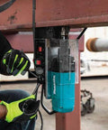 Makita HB350 1-3/8 in magnetic drill, teal body, installed on steel beam with gloved operator