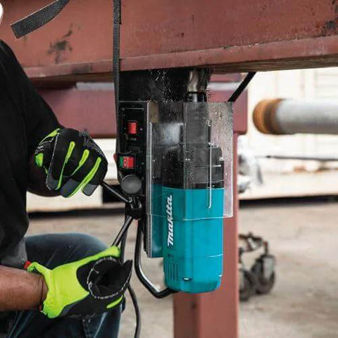 Makita HB350 1-3/8 in magnetic drill, teal body, installed on steel beam with gloved operator