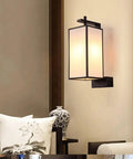 Knockout Indoor Rectangular Wall Light Featuring Handmade Linen Shade And Corrosion Resistant Iron Body giving a modern vibe in a bedroom setting.