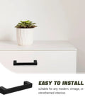 Vintage Zinc Alloy Cabinet Handles Matte Black For Kitchen And Dresser Drawers shown on white cabinet with plant