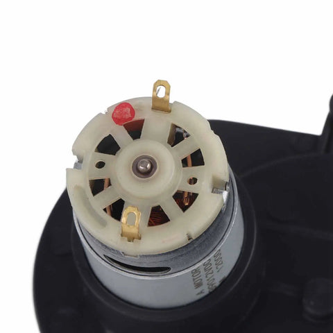 Close-up of RS390 Electric Motor Gearbox 12V High Torque DC Speed Drive Replacement with visible connectors for ride-on vehicles.