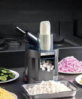 Front view of Amazon 4-in-1 electric vegetable slicer and chopper, gray body with dual feed chute and cube tray.
