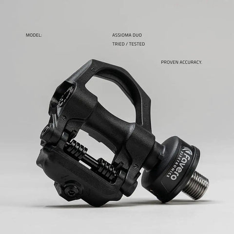 Dual Sensing Pedal Based Power Meter with extra cleats for road cycling, easy to move between bikes, black pedal showing bearings.