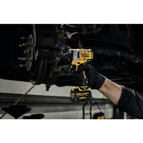 Mechanic using Xtreme 12V Max Brushless One Half Inch Cordless Impact Wrench Tool Only on car wheel bolts