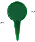 Green plastic Spreader Seed Planter for Gardens and Farms, Manual Seed Seeder Tool, 12cm by 6cm, top view.