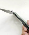 Damascus Pocket Folding Knife With 3.26 Inch Sharp Blade And G10 Handle shown open in hand