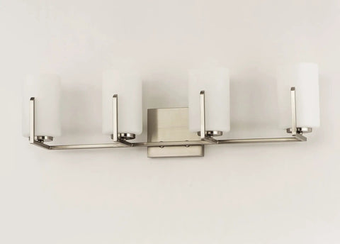 Dart 4 Light Bath Vanity Fixture In Satin Nickel Steel Finish With Satin White Glass Shades, mounted on wall, front view