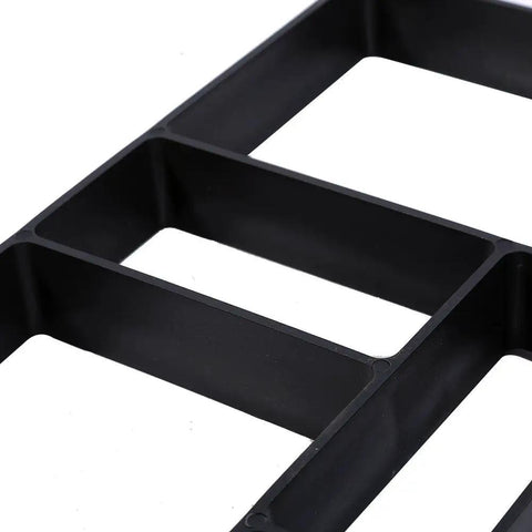 Close-up view of a black Concrete Mold 45x40x4cm 10 Cell Paver Mold for DIY Garden Walkway, highlighting cell compartments.