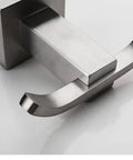 Close-up view of Slick Brushed Stainless Steel Double Robe Hooks With No Hassle Wall Mount For Bathroom And Shower.