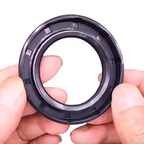 Person holding a part of Beefed Up Rotary Cutter Gearbox Seal Set For 40HP And 50HP Units Includes Input And Output Seals Replacement Parts