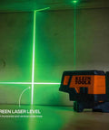 Compact Self Leveling Laser Level With Plumb Spot, Bright Green Cross Lines, 75 Foot Range on wooden surface