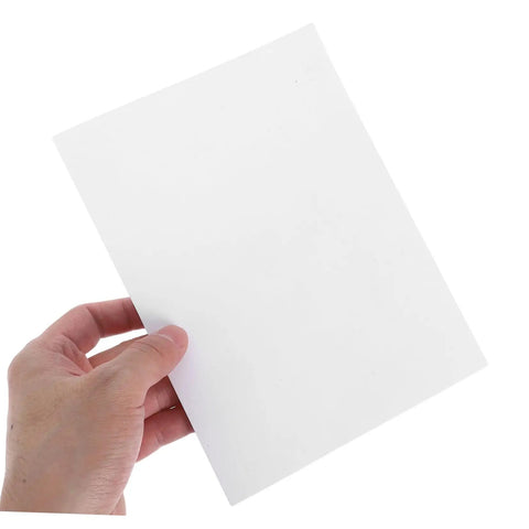 Hand holding a vinyl patch from the 12 Piece Vinyl Patch Kit For Wall Repair Self Adhesive Patches For Cracks Holes And Blemishes Quick Install