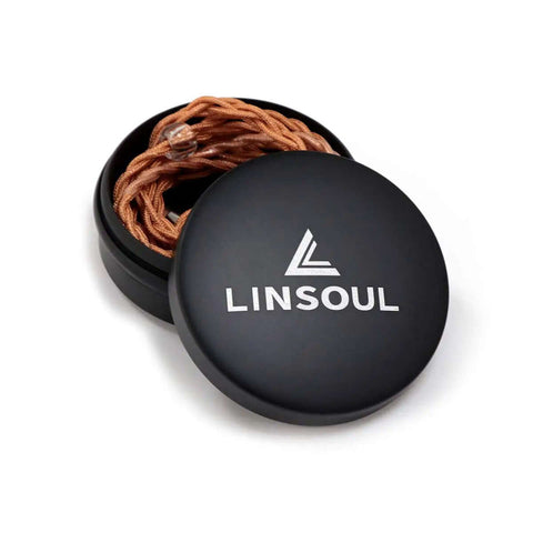 Compact Aluminum Earphone Case Built Different For Road Trips And Daily Drivers Featuring A Water Resistant Shell with earbud cables neatly stored.