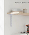 Beefy Heavy Duty L Shaped Wall Mount Bracket for Floating Shelves and Cabinets in white finish, stud mounted, view with tools