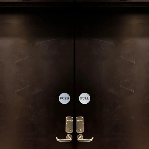 Two Inch Round Push Pull Door Signs Brushed Gold Set Of Two Durable Plastic With Strong Adhesive Foam Tape For Super Easy Install And Clear Legible Messaging In Offices Homes Or Commercial Doors. Applied on dark double doors