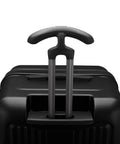 Close-up of matte black durable spinner luggage handle for frequent flyers