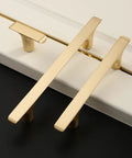 Brushed Gold Cabinet Pulls Pack Of 10, 5 Inch Hole Centers, Zinc Alloy And Brass Construction, Kitchen Handles on white surface ZH0028